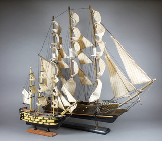 A wooden model of HMS Victory 12" and a wooden model of a  3 masted war ship 22"