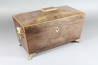 A Regency rosewood sarcophagus shaped twin compartment tea  caddy with mixing bowl, having gilt pressed metal ring handles,  raised on paw feet 6.5"h x 12"w x 6"d