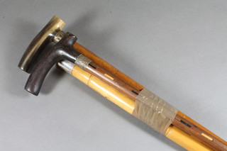 2 walking canes with horn handles and a bamboo cane with silver mounted handle