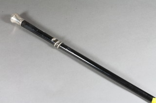 A Victorian ebony walking cane with silver knob decorated a climbing serpent, London 1832