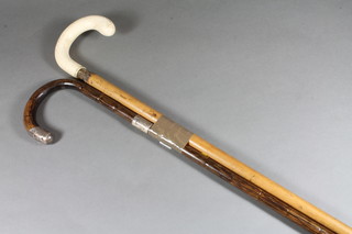 A Malacca cane with ivory handle and a bamboo cane with silver mounts