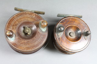 A 19th Century wooden Starback centre fishing reel 4" and 1  other centre pin reel 4.5"
