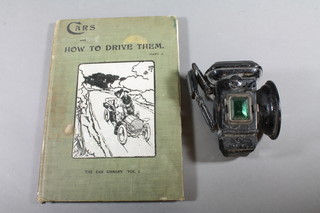 A cycle lamp together with 1 volume "The Car Library, Cars and  How To Drive Them" second edition 1903