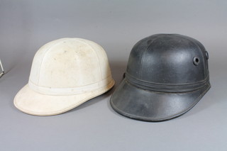 A white Skullgard motorcycle helmet and a Corker motorcycle helmet  ILLUSTRATED