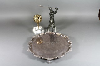 A bronzed spelter figure of a 1930's standing golfer 9", a gilt  metal paperweight in the form of a golf ball and tee raised on a  perspex stand 6", together with a silver plated salver with  bracketed border marked The Dukes Golf Society 1963,  Captain's Prize