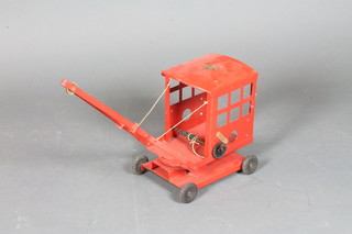 A Triang red painted model of a crane