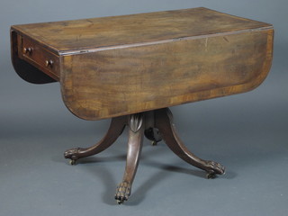 A William IV mahogany pedestal Pembroke table, cross banded,  fitted end drawer with opposing faux fronted drawer, raised on a  turned reeded column, quadripartite base with claw feet 29"h x  42"w