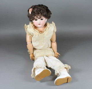Armand Marseille, a bisque headed doll with go to sleep eyes  and open mouth with teeth, head incised Armand Marseille  390AGM, having jointed composite body 22"