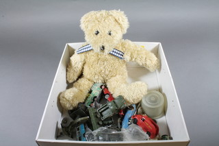 A Schuco micro racer Grand Prix car No.1040 together with various Dinky military vehicles and a teddybear