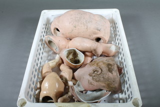 A Simon & Halbig bisque doll, heavily damaged, together with a  small baby doll