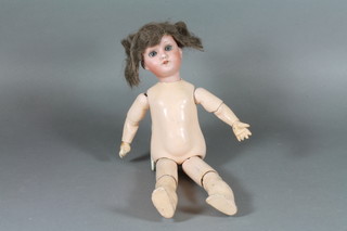 An early 20th Century Max Oscar Arnold bisque hold doll,  manufactured by Welsh & Co., having blue go to sleep eyes, with open mouth, the head numbered 200, 4/0, having jointed  composite body 12"