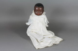 An early 20th Century Armand Marseille black baby doll with go  to sleep eyes, closed mouth, the head impressed 341./2 1/.2K  with fixed composite body, approx 12"h