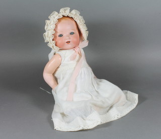An early 20th Century Armand Marseille baby doll having blue  go to sleep eyes and open mouth, the head marked 351./3.1/2K  with composite body 14"h