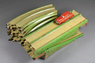 An early 20th Century English tin plate model car 2 lane racing  track together with a clockwork saloon car