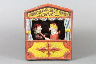A Victorian style cast iron novelty money box, the Punch and  Judy bank, painted with enamels 7"h x 6"w