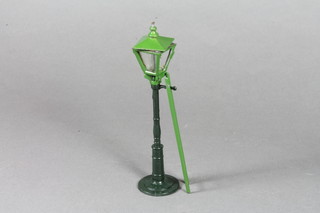 An early 20th Century die cast miniature model of a street gas  lamp and ladder, marked to base Hill.Co.England, boxed 5.5"h