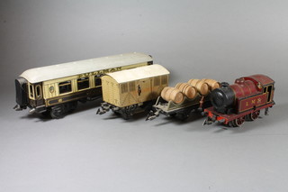 A Bing "O" gauge clockwork tank locomotive, with black and maroon LMS livery 7"l, a Bing "Minerva" Pullman carriage 13"l, a Bing refrigerator truck 6.5"l and a Bing 4 barrel wagon 8"