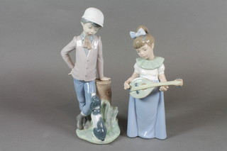 A Nao figure of a standing girl with mandolin 7", r, together with 1 other of a standing boy and dog 8.5"