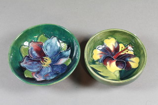 A Moorcroft circular green glazed Hibiscus pattern bowl 3.5"  diam. together with 1 other bowl 3", both with impressed  Moorcroft mark to the base