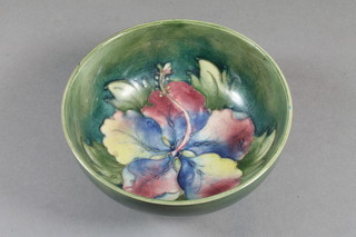 A Moorcroft circular green glazed Hibiscus pattern bowl 5"