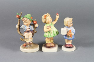 A Hummel figure of a standing girl with posy and 2 other  Hummel figures of standing girl and boy in apple tree 4"