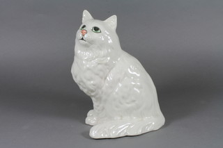 A Beswick seated white Cheshire cat 8"
