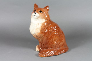 A Beswick seated ginger Cheshire cat 8"
