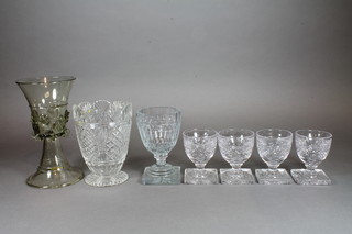 A Venetian green glass goblet raised on spreading foot, signed YF, a Victorian cut glass tea caddy mixing bowl, a 19th Century  cut glass with square foot and 4 glasses with square feet