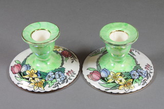 A pair of Malingware blue glazed and floral decorated stub candlesticks, base marked 6524, 3"