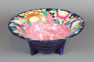 A Malingware circular pottery bowl with floral decoration, base  marked 6505P 9"