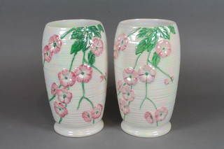 A pair of Malingware cylindrical pink glazed vases with floral decoration 8.5"