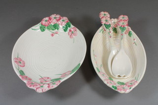 A Malingware oval bowl with floral decoration 11", a similar  dish 8" and a pair of salad servers