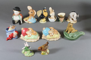 A Royal Doulton Winnie The Pooh series figure - Eeyore's Birthday, do. Piglet Picking, a small character jug of Dick Turpin, Beswick figure - Sally Henny Penny, Beswick bird, 3 Pendelfin figures etc