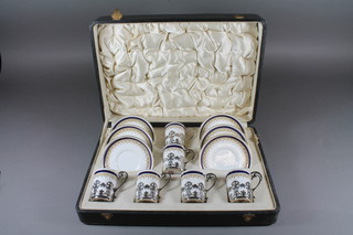 A Worcester 12 piece blue and gilt banded coffee service comprising 6 cups and 6 saucers - 2 saucers cracked, 1 f and r,  with silver mounts London 1918, cased
