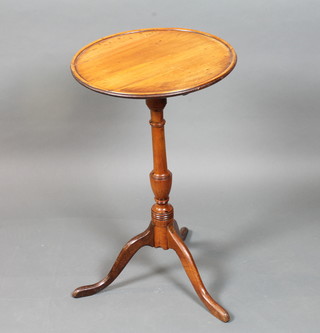 A late George III yew wood mahogany and oak occasional table  with circular moulded top, raised on a turned column tripod base  27.5"h x 16"diam.