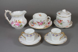 A 22 piece Derby posy pattern tea service comprising 3 tea plates 6.5", 4 cups and 4 saucers - 1 cup cracked, large cream jug 3.5",  boat shaped cream jug 3" - cracked, baluster cream jug 3",  preserve jar and cover 3" - cracked, 4 egg cups - 2 cracked,  waisted specimen vase 2.5", circular bowl 3.5", shaped dish 4",  together with a Continental 12 piece tea service with gilt and  green banding comprising 6 cups and 6 saucers - 1 saucer  chipped, 1 cup chipped