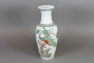 A 20th Century white glazed Chinese club shaped vase decorated bird amidst branches with script, the base with seal mark 12.5"