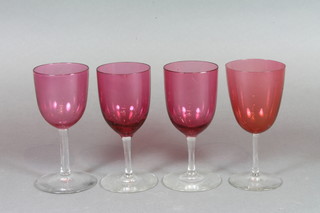 4 Victorian cranberry glass wine glasses with clear glass stems