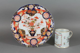A Sevres porcelain mug with gilt banding and floral decoration,  base marked MD 1795 Sevres, with strap work handle, together  with an ironstone Imari pattern plate 10"