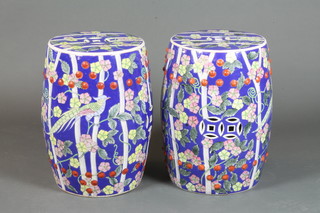 A pair of Chinese barrel shaped garden seats with floral  decoration 19"