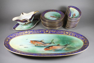 A 26 piece Japanese Meito porcelain fish service comprising  oval platter 22", sauce boat 12", ladle, 12 crescent shaped salad  plates 8", 11 plates 8", all with gilt banding and painted fish by  H Tchikawa