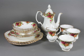 A 95 piece Royal Albert Old Country Rose pattern tea/coffee  service comprising 3 bread plates 9", do. 9.5", circular bowl 8",  do. 6.5", 4 cereal bowls 6", 4 butter dishes 4.5" - 1 cracked, 9  cups - 1 cracked, 2 coffee pot - lids cracked, sugar bowl, cream  jug, 3 shallow dishes 5.5", 29 tea plates - 5 seconds, saucer 6",  11 saucers 5.5" - 1 second, 19 pudding bowls 5.5" - 1 cracked,  15 seconds,