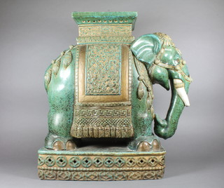A green glazed pottery garden seat in the form of an elephant  21"h