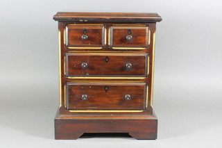 A miniature mahogany chest, parcel gilt, fitted 2 short above 2 graduated long drawers on shaped plinth base 14"h x 11.5"w x  8"d