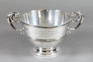 A silver twin handled trophy cup on a circular spreading foot,  London 1911, 6 ozs