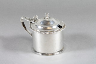 A cylindrical George IV silver mustard pot, London 1823  complete with blue glass liner 4 ozs