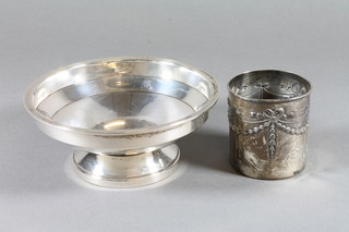 An Art Deco circular silver pedestal bowl, Birmingham 1931, together with a circular silver bottle mount with swag decoration,  Chester 1908, 4 ozs