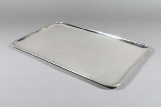 A rectangular silver tray with harebell border, London 1903, makers mark Walter Walker & Brownfield Tolhurst, 12 ozs