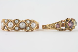 A 15ct gold ring set demi-pearls and a 15ct gold dress ring set  red and white stones - 1 missing,