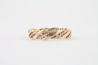 A 9ct pierced 2 colour gold "rope twist" wedding band